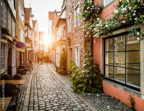Obraz na płótnie canvas czteroczęściowy "tetraptyk" Historyczny Schnoorviertel o zachodzie słońca w Bremie, Niemcy