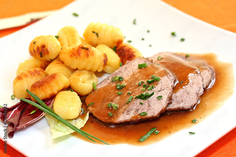 Schweinebraten Mit Gnocchi Stock Photo Adobe Stock