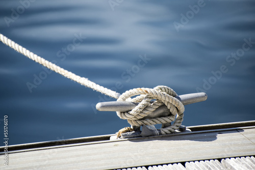 Detail image of yacht rope cleat on sailboat deck