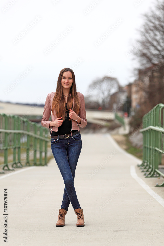 Beautiful Brunette Girl Wearing Leather Jacket Blue Jeans And Boots Stock Photo Adobe Stock