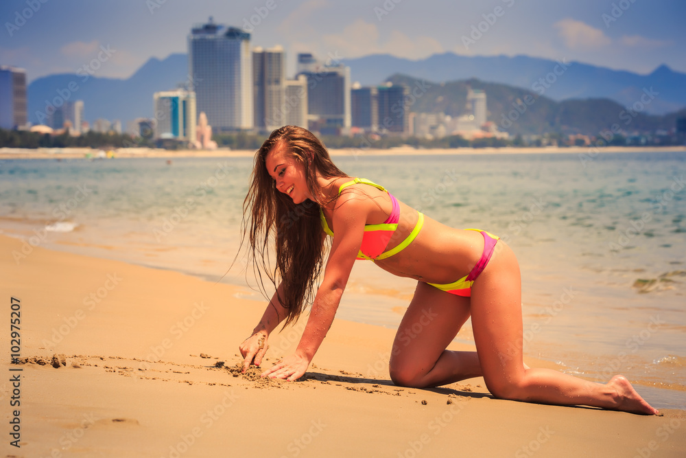 Blonde Slim Girl In Bikini Moves On Hands Knees Out Of Water Stock