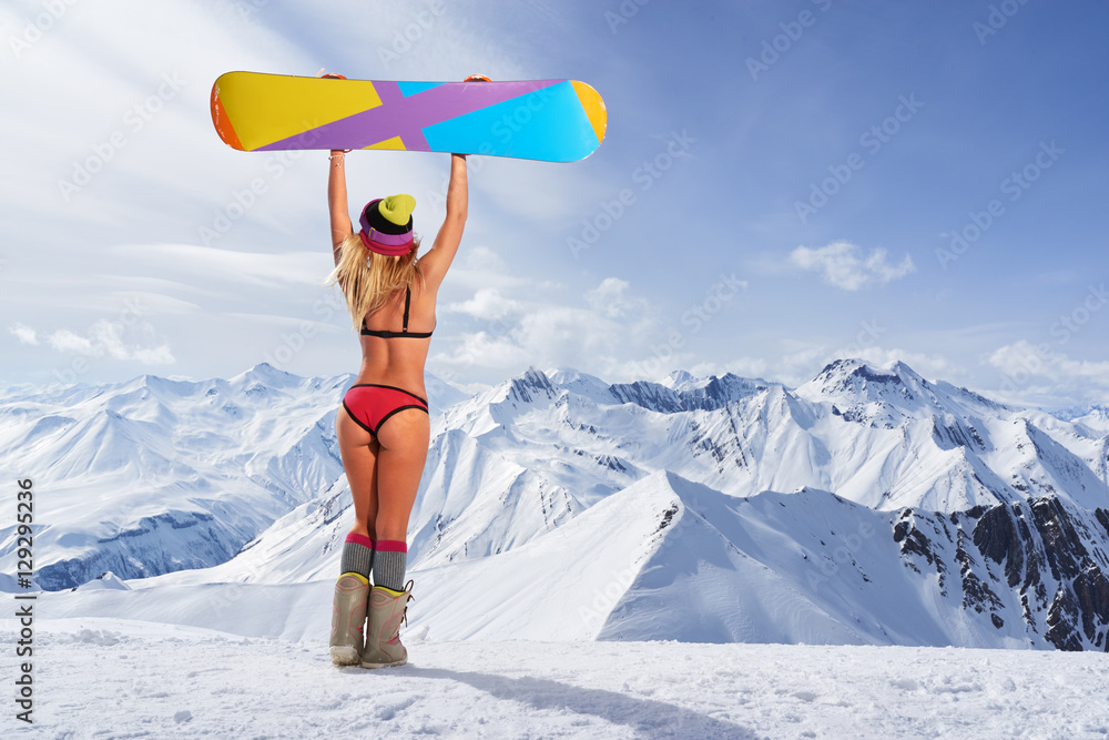 Back View Of Girl In Bikini Holding Snowboard Above Head Stock Photo Adobe Stock