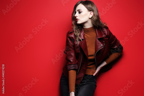 fashion model  beautiful young woman. leather jacket, studio shot
