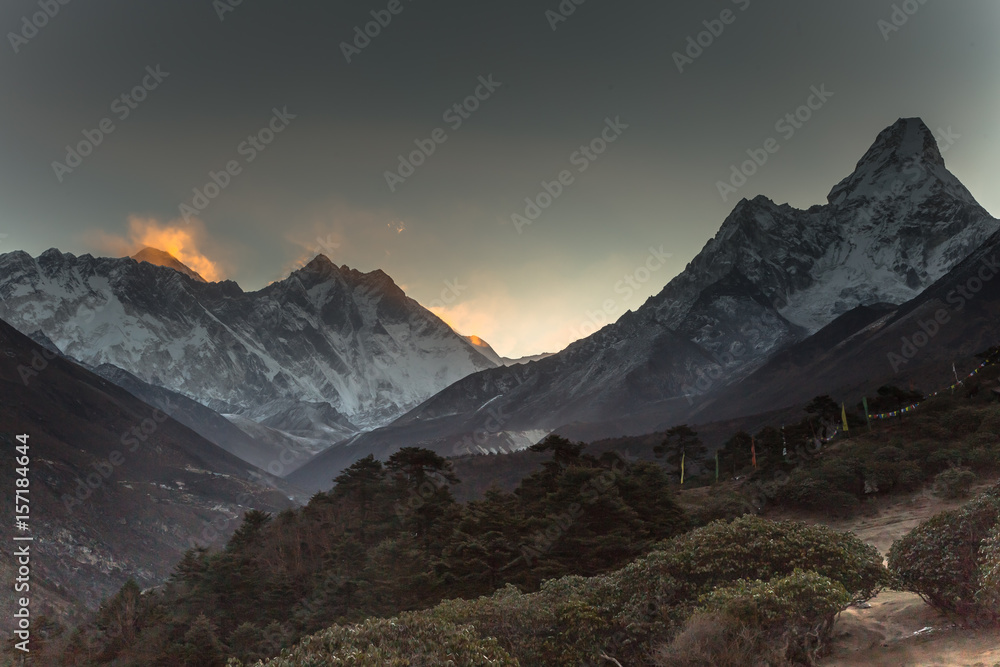 Sunrise in Himalayas. Ama Dablam, Nuptse, Lhotse and Everest in first rays of sun. Two eight-thousander peaks. View from Tengboche. Sagarmatha National Park, Solukhumbu District in Nepal, Asia. 