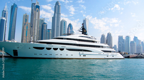 Yacht in dubai marina in front of high-rise buildings on 26th November 2016