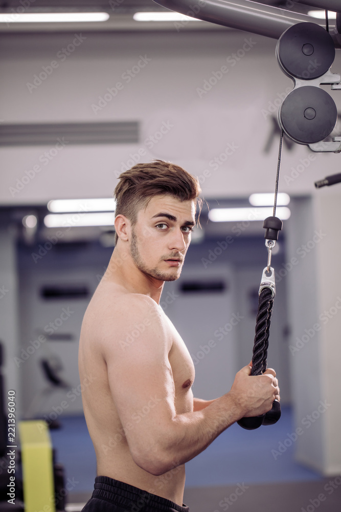 Handsome Muscular Guy With Naked Strong Body Exercising At Gym