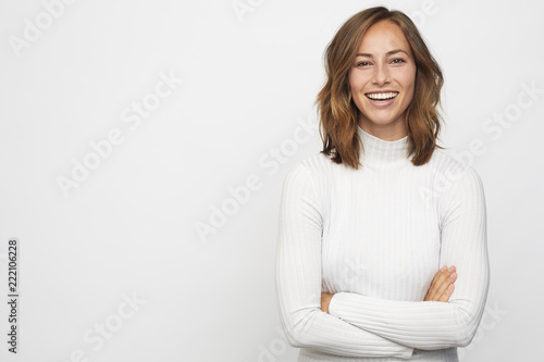portrait of young happy woman looks in camera