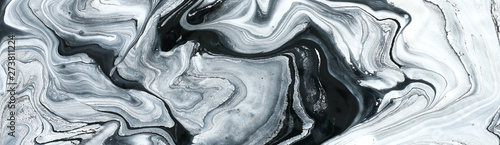 photography of abstract marbleized effect background. black and white creative colors. Beautiful paint. banner