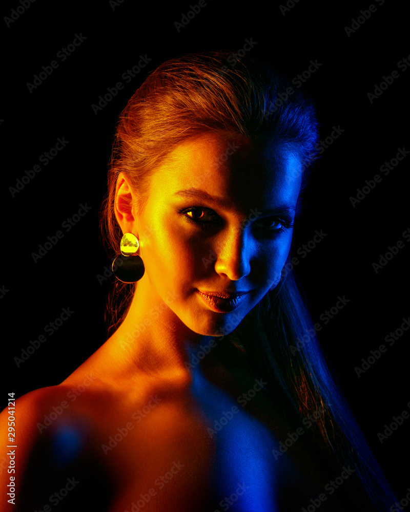 Beautiful Sexy Woman In Colorful Design And Glitter Vivid Neon Lights Posing In Studio Portrait