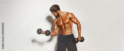 Handsome Muscular Men, Bodybuilder Lifting Weights. copy space