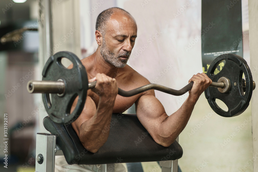 Muscular Shirtless Mature Older Bodybuilding Athlete With Balding Gray