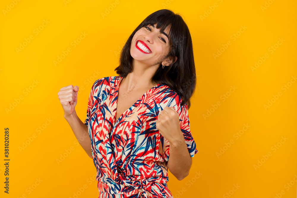 Caucasian Brunette Woman Rejoicing Her Success And Victory Clenching Her Fists With Joy Lucky