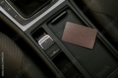 Blank brown business card on a center of car console space