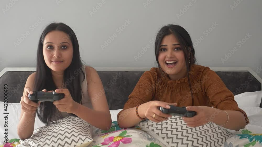 Wideo Stock Two Beautiful Female Friends Lesbian Couple Playing Video