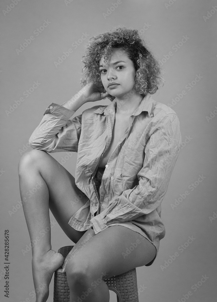 Portrait Of A Semi Nude Woman In Black And White In A Photo Studio