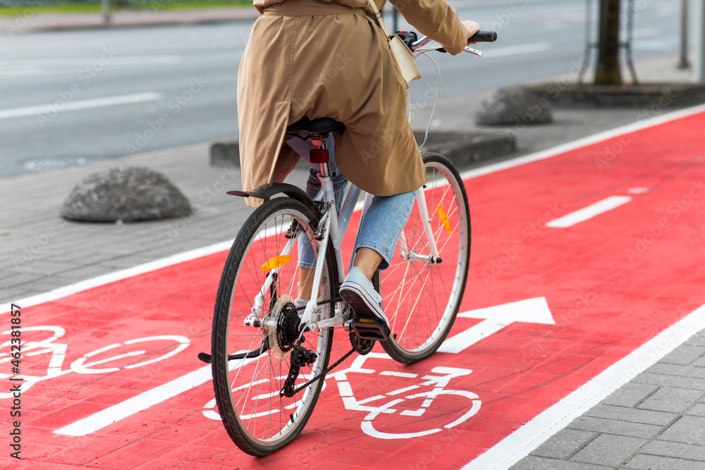 Traffic City Transport And People Concept Woman Cycling Along Red