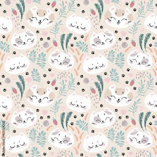Seamless pattern with cute cat faces and cat footprints. Ornament for children's textiles, typography.
