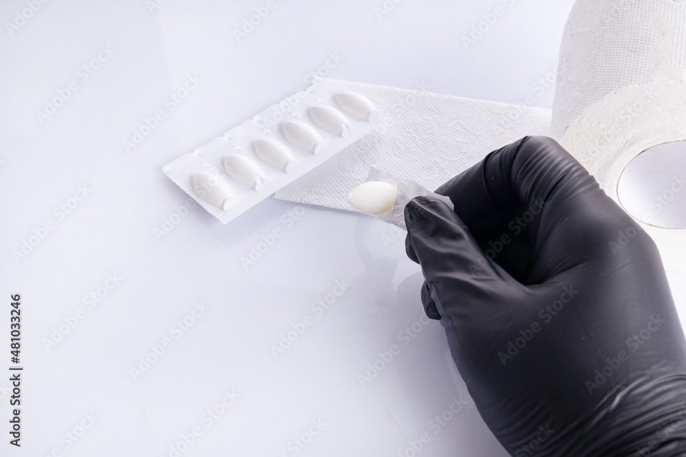 Hands In Black Gloves Opens Suppositories For Anal Or Vaginal Use