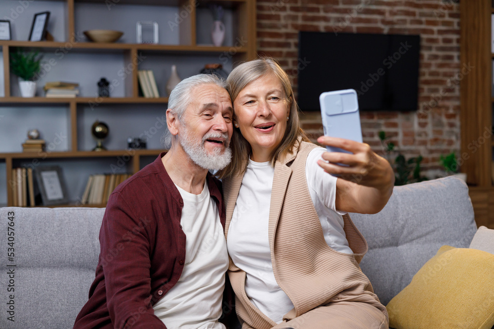 Mature Happy Couple Fooling Around On Smartphone Camera Gray Haired Husband And Wife Are