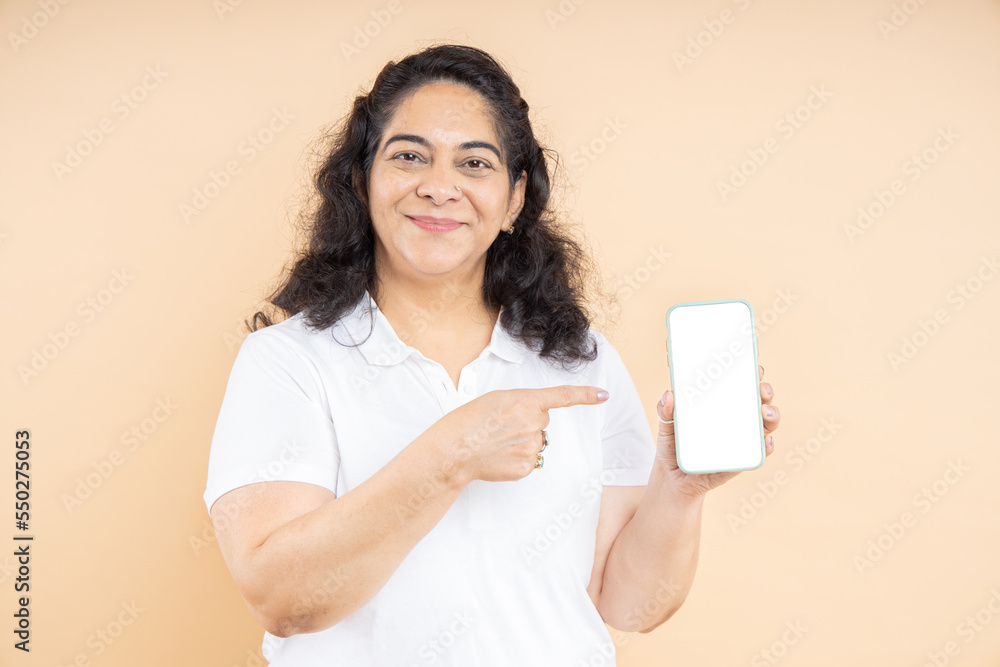 Happy Indian Mature Senior Woman Holding Blank White Screen Smart Phone Showing Copy Space For