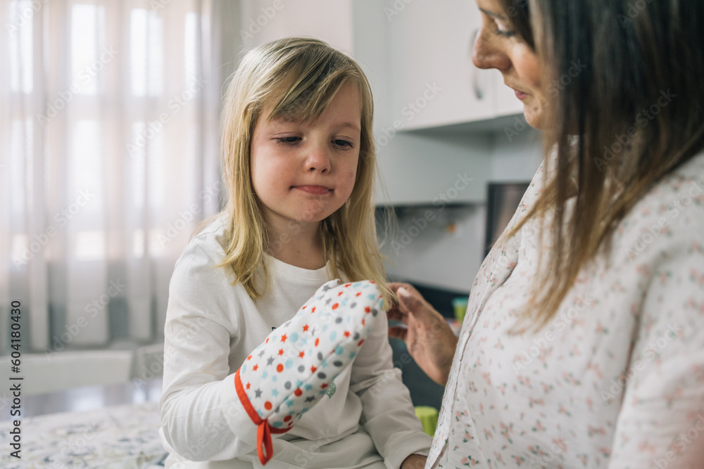 Mother Of Blonde Girl Looking Tenderly At Her Daughter Who Is Pouting Stock Photo Adobe Stock