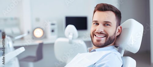 Young man receiving dental care with copy space for background