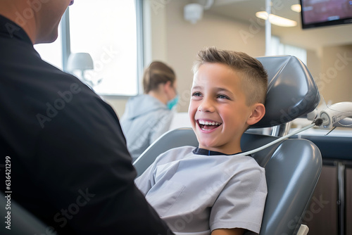 Cute smiling boy visits the dentist for check-up and treatment of teeth.