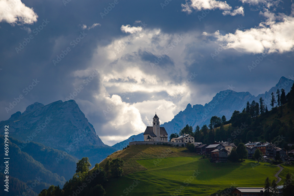 Picturesque View Of Rocca Pietore Village With His Small Church