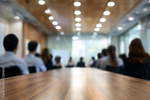 Blurred business people meeting in modern office building conference room, abstract background