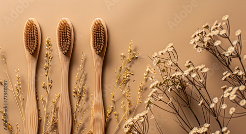 Eco-friendly wooden toothbrushes with natural bristles on beige studio background.