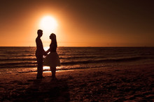 Silhouette Of Couple At Sunset