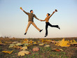 © Pavel Losevsky - jump couple autumn leaves