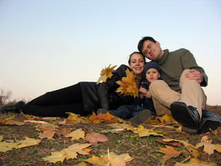 family with autumn leaves