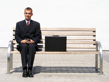 Businessman Sitting On Bench