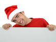 man wearing christmas hat holding white card