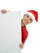 man wearing christmas hat holding white card