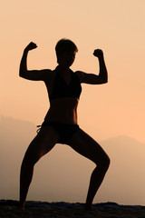 athletic woman  at sunset