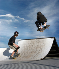 girl and a boy skateboarding