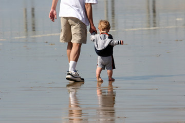 father and son on the beach