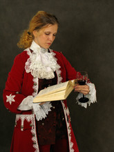 Woman In Old-fashioned French Clothes Reading A Book
