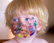 Young Boy Covered In Face Paint