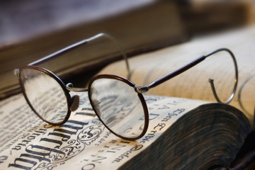 book and eyeglasses