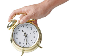 hand holding alarm clock