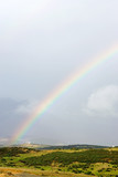 Fototapeta Tęcza - rainbows end after a storm in spain