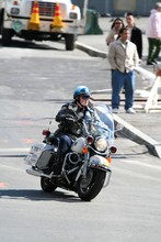 Policeman Riding A Motorcycle