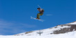 © Nick Stubbs - man skiing on slopes of ski resort in spain