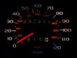 glowing car spedometer in darkness