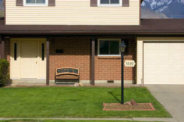 front of a house with mountains on the background