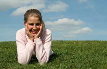 girl lying on grass