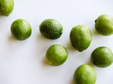 Green Key Limes On White Background